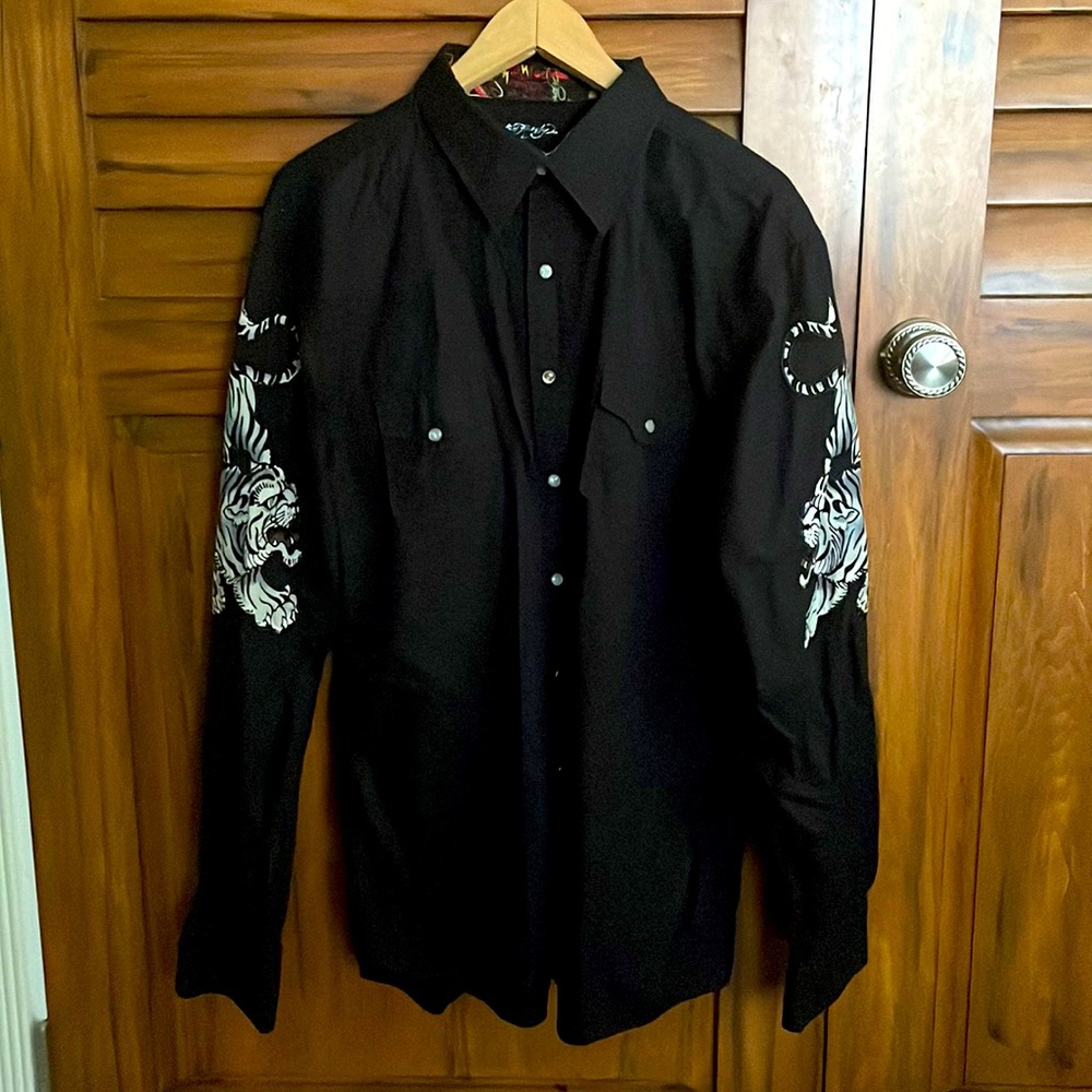Button up Ed Hardy shirt.  It’s slightly worn and is a medium in size